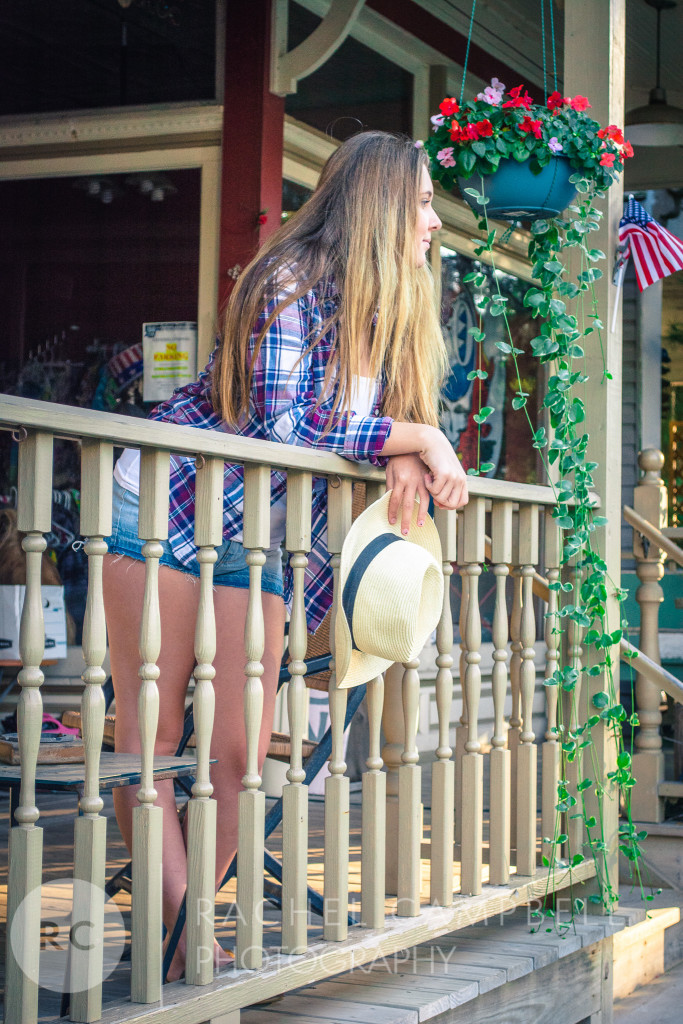 Senior portrait of a young woman at sunset leaning on a railing in Solon Ohio