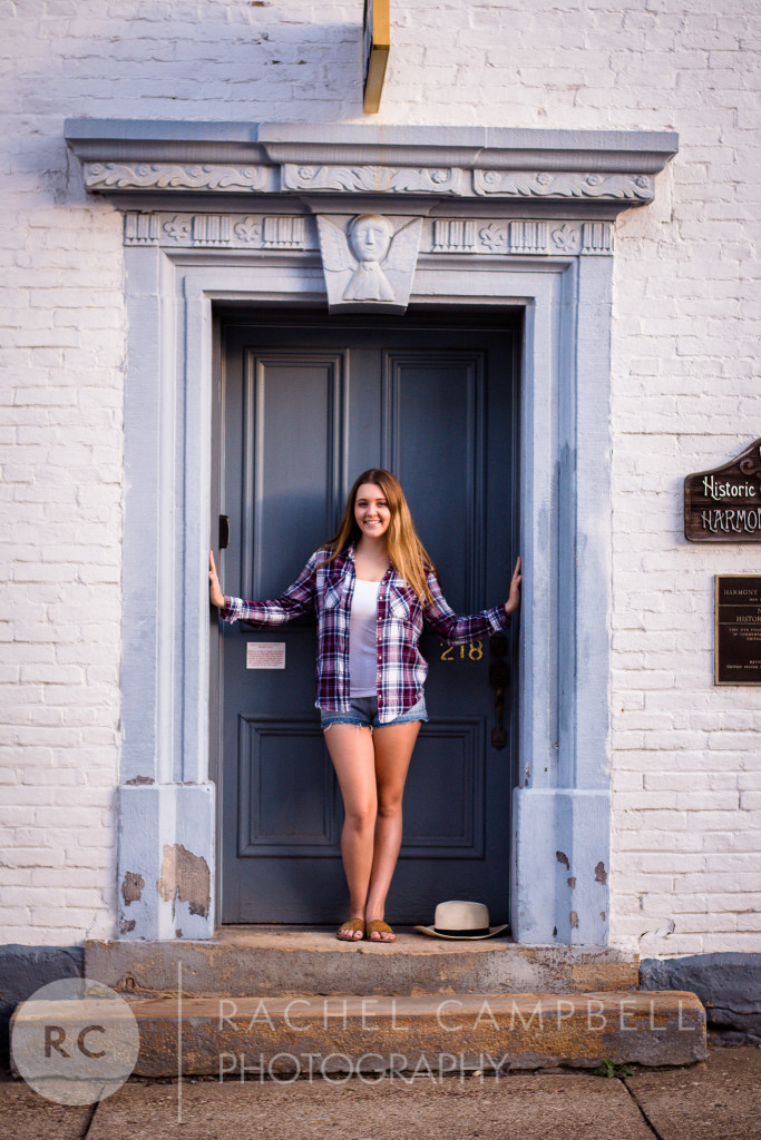 Senior portrait of a young woman standing in a doorway in Solon Ohio