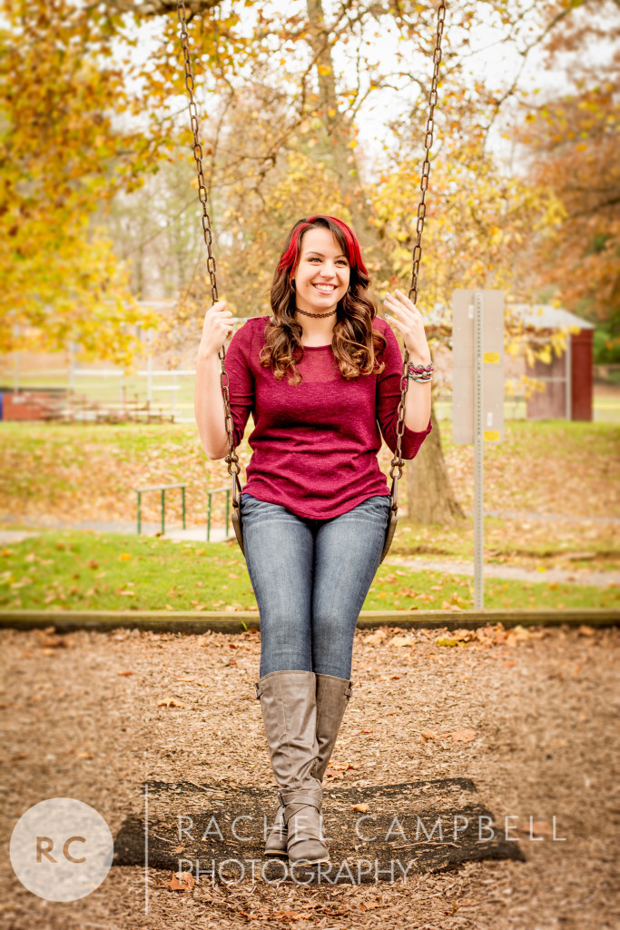 Senior portrait of a young woman sitting on a swing in Solon Ohio