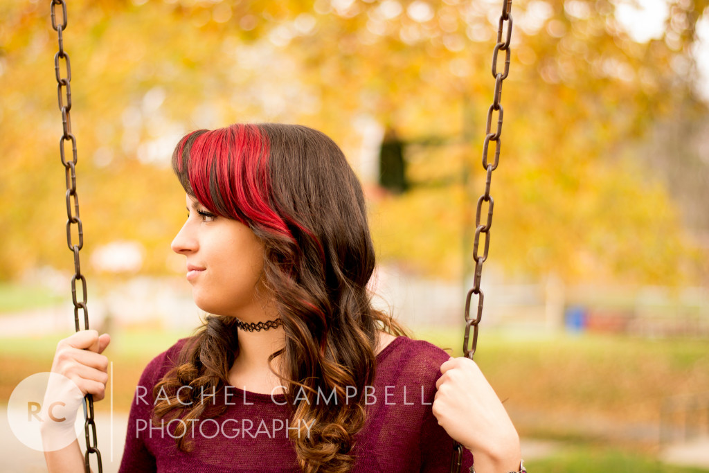 Senior portrait of a young woman sitting on a swing in Solon Ohio