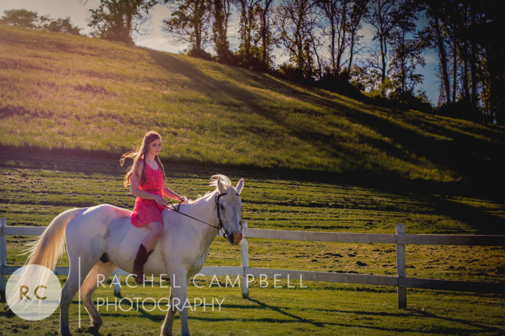 Senior portrait of a young woman riding her horse in Solon Ohio