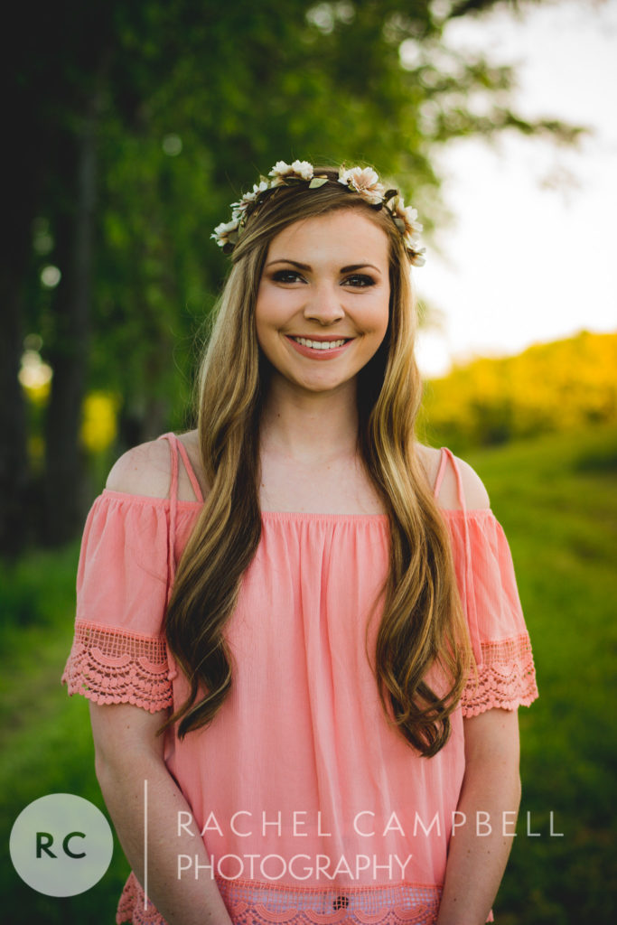 Senior portrait of a young woman in a field at sunset in Solon Ohio