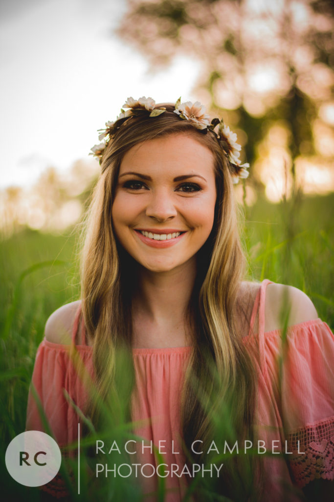 Senior portrait of a young woman in a field at sunset in Solon Ohio