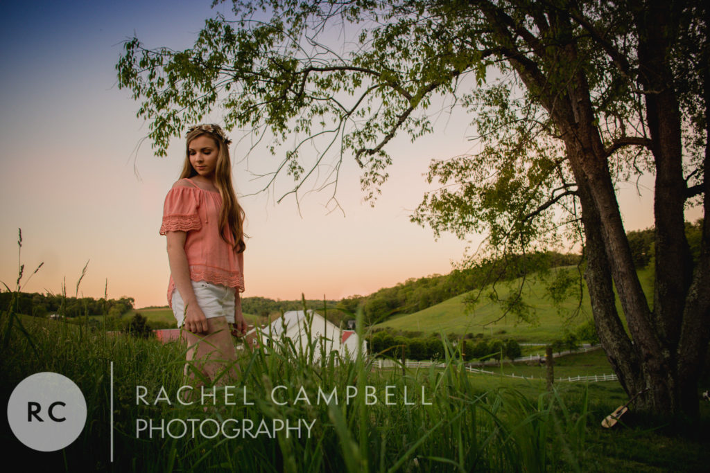 Senior portrait of a young woman standing in a field in Solon Ohio