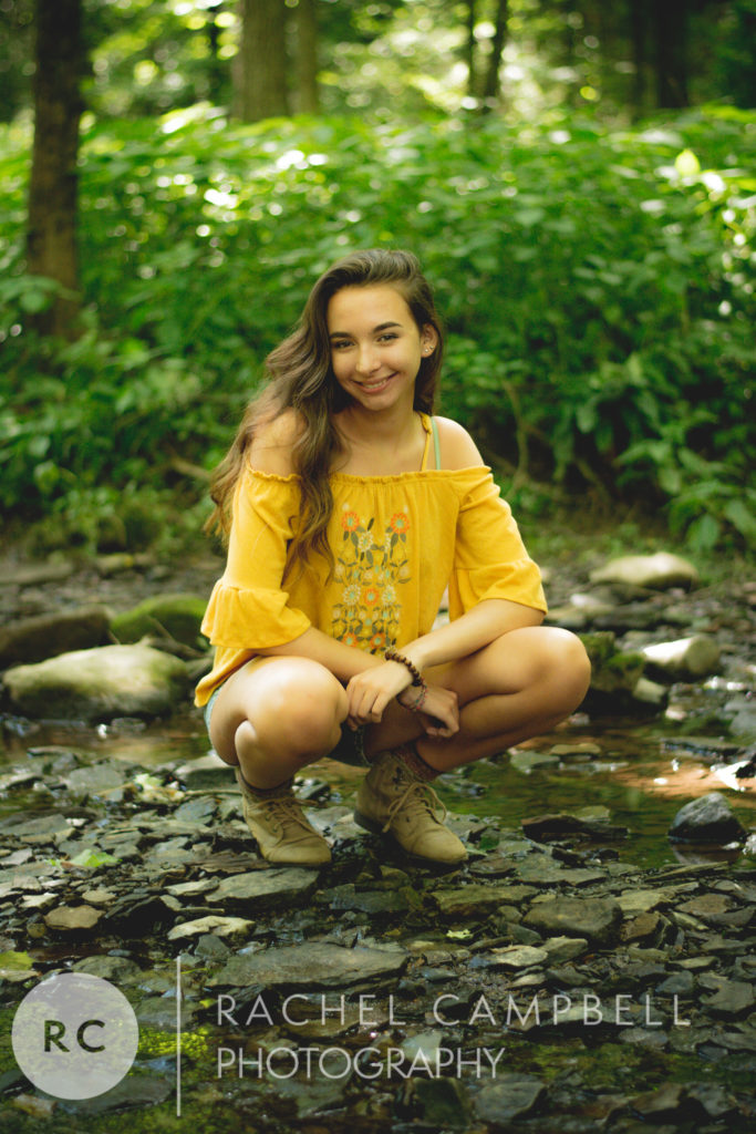 Senior portrait of a young woman in the woods in Solon Ohio