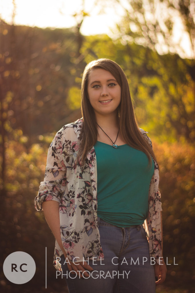 Senior portrait of a young woman in a park at sunset in Solon Ohio